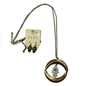 Earring and necklace set new in package never worn or used! Palm with evil eye.